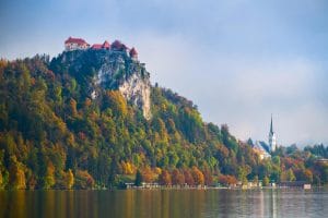 Bled Castle on the cliff above Lake Bled in autumn