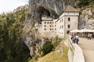 Entrance area of Predjama Castle built into the cave cliff