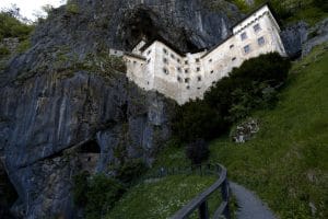 Exterior view of Predjama Castle from the visitor path below the cliff