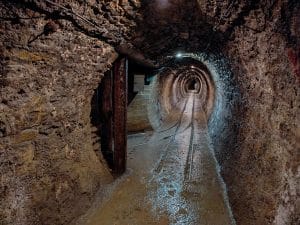 Rough rock tunnel inside the historic Idrija Mercury Mine