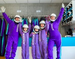 Family wearing flight suits and helmets at Aerodium Logatec
