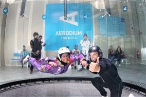 First-time flyers enjoying indoor skydiving at Aerodium Logatec in Slovenia