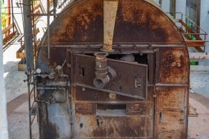 Close-up of historic industrial furnace equipment at the Idrija Mercury Smelting Plant